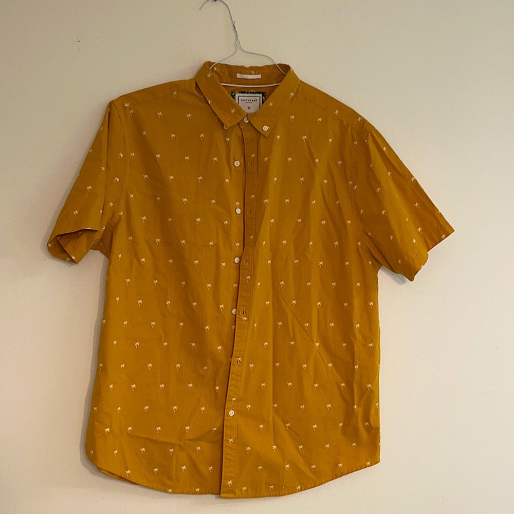 Orange shirt with white palms